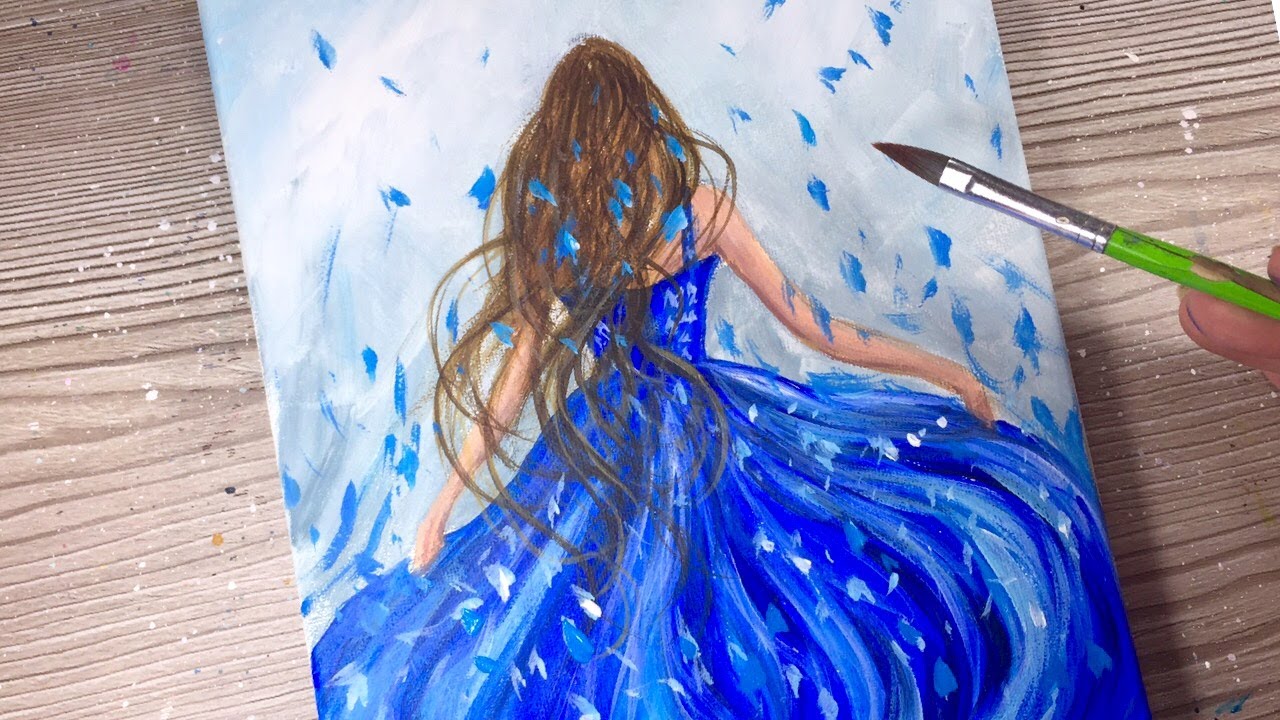 woman in blue dress painting